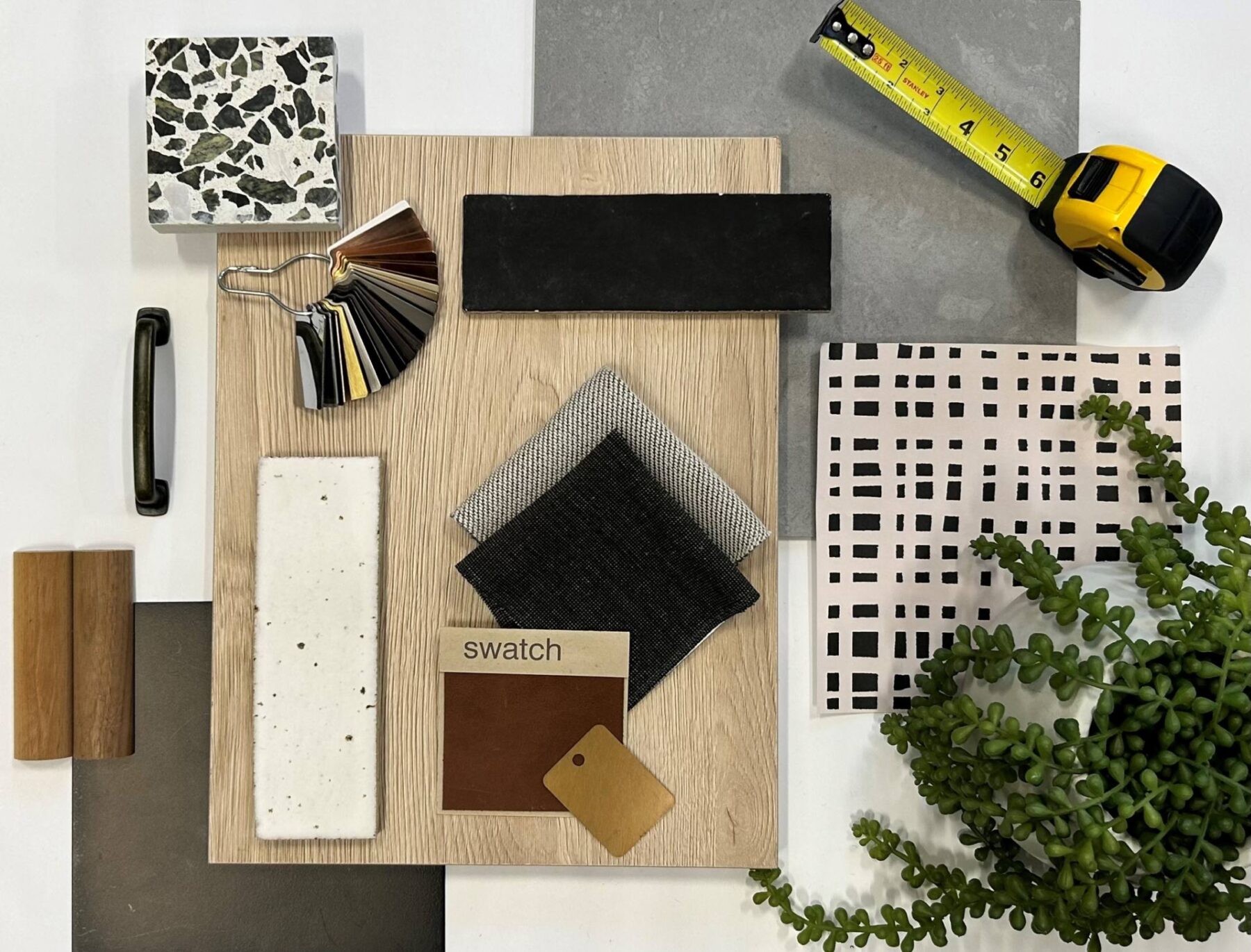 various material and color swatches arranged on a table